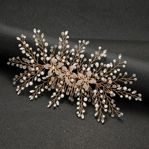 Luxurious bridal hair comb featuring golden alloy flowers with pearls and crystals