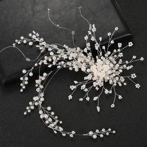 Elegant bridal hair vine with white pearls and small floral beads on flexible silver wire