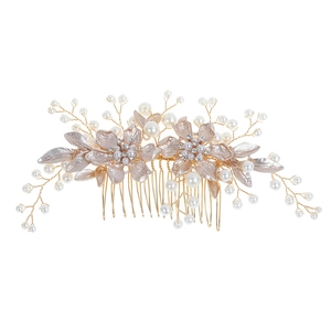 Champagne gold bridal hair comb with pearls and rhinestone floral accents on white background