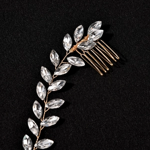 Detailed macro view of handmade golden wire hair comb with marquise cut rhinestones