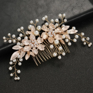 Elegant gold flower wedding hair comb with white pearls and sparkling rhinestones
