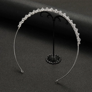 Close-up of crystal bridal headband with silver wire wrapping and metal fixing loops