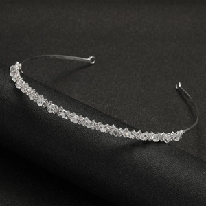 Exquisite silver crystal bridal headband with sparkling multi-faceted rhinestones for weddings