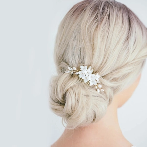 Handmade bridal hair comb featuring white ceramic flowers, pearls and crystals
