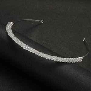 Exquisite silver crystal bridal headband with intertwined clear beads for weddings and parties