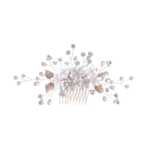 Handmade bridal hair comb with white clay flowers and rose gold leaves on white background