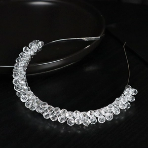 Elegant silver bridal headband with faceted clear crystal beads on a delicate wire frame
