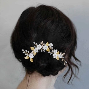 White clay flower hair pin set with golden leaves and pearls for bridal hairstyles