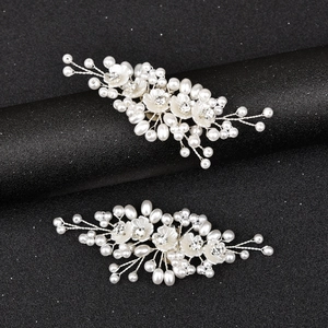 Elegant silver bridal shoe clips with handmade flowers and white pearls for wedding shoes