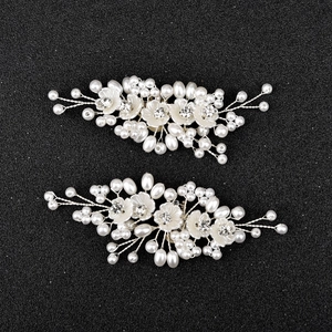 Handmade bridal shoe clips with pearls and white flowers on elegant silver wire frames