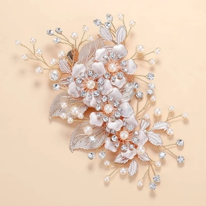 Elegant gold hollow leaf hair clip with white flowers and pearls for bridal wedding look