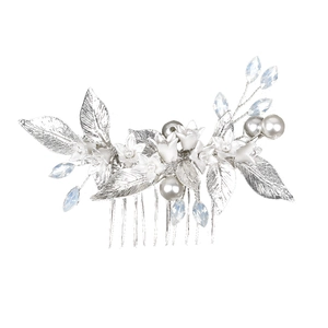 Detail of bridal hair comb with white ceramic flowers, pearls and crystal drops