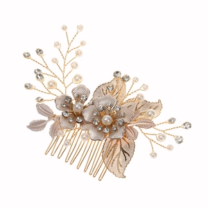Golden bridal hair comb with metal leaves, white pearls and sparkling rhinestones