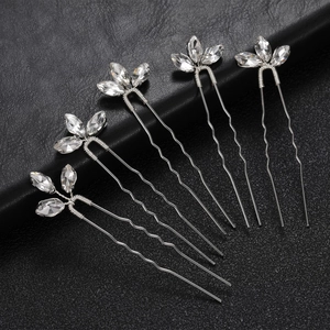 Detailed view of 5-piece silver U-shaped hair pins with sparkling marquise rhinestone leaves