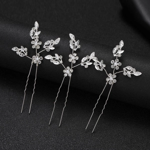 Three-piece set of silver leaf bridal hair pins with rhinestones and pearls