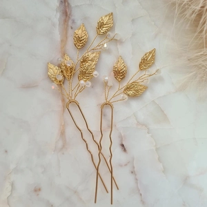Elegant gold leaf bridal hair pins set with opal white crystal beads for wedding styling