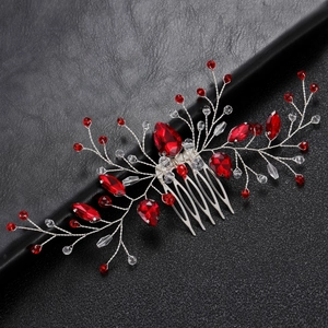 Detailed view of red marquise crystal hair comb with silver wire bridal headpiece