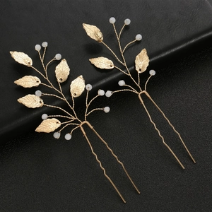 Golden leaf hair pins set with white pearls and branch design for wedding hairstyles