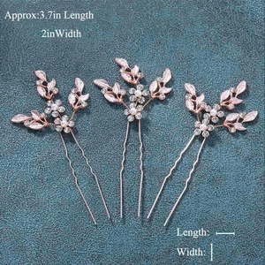 Detail of rose gold bridal hair pin set with pink leaves, pearls and crystals