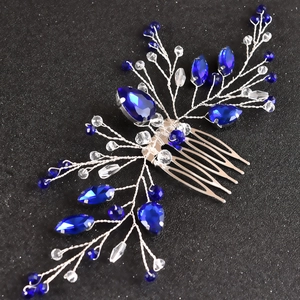 Detailed macro view of handmade silver branch hair comb with royal blue navette crystals