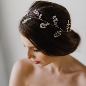 Close-up of flexible gold crystal vine hairband for bridal wedding hairstyles