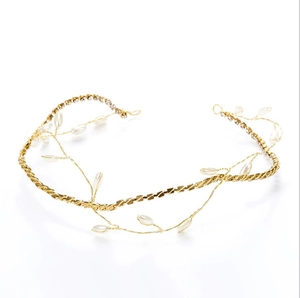 Elegant gold bridal headband featuring white pearls and delicate rhinestones