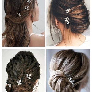 Set of three silver U-shaped hair pins with sparkling leaf-shaped rhinestones for hair styling