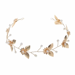 Elegant gold bridal headpiece with hollow flowers, metallic leaves, and white pearls