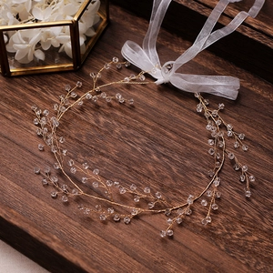 Golden bridal hair vine with crystal beads and white organza ribbon for weddings