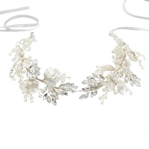 Macro shot of silver bridal hair vine with crystal leaves and imitation pearls