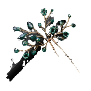 Handmade U-shaped hair pin with emerald green crystals and gold wire floral branch detail