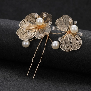 Elegant gold hollow flower hair pin with pearls and crystals for bridal styling