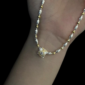 Pendente vintage bicolore oro e argento con pizzo stellato e perline a oliva
