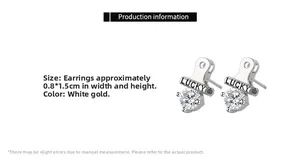 Detail showing white gold stud earring with LUCKY engraving and cubic zirconia, 0.8x1.5cm