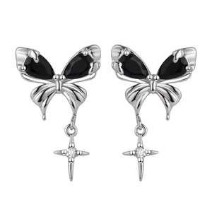 Silver butterfly earrings with black drop stones and star charm in a symmetric layout