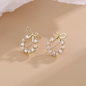 Minimalist gold bow earrings with pearls and zircon stones for women's elegant daily wear