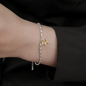 Elegant silver bead bracelet with gold H-letter charm and sparkling cubic zirconia crystal