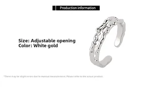 Close-up of irregular textured open ring in white gold finish with size specifications