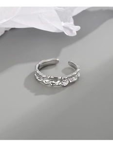 Detailed macro view of S925 sterling silver stamp inside irregular minimalist open ring