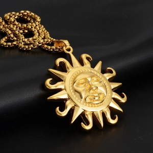 Hiphop sun face pendant necklace in gold finish with box chain on black background