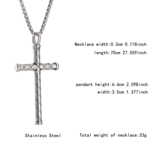 Detail view of silver stainless steel cross necklace with engraved lattice pattern