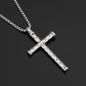 Detail of silver stainless steel cross pendant with textured scale pattern on box chain
