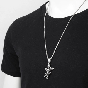 Hiphop silver angel pendant necklace with vintage embossed detail on a black crewneck shirt