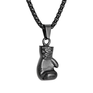Macro detail of a 3D black boxing glove pendant with matching box chain necklace