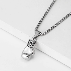 Close-up of polished silver boxing glove pendant with a durable stainless steel box chain