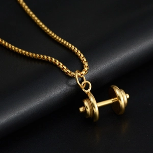 Golden barbell pendant necklace for men and women on premium black leather background