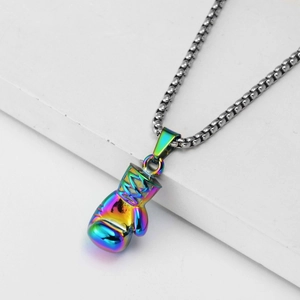 Macro detail of rainbow electroplated boxing glove pendant with stainless steel box chain