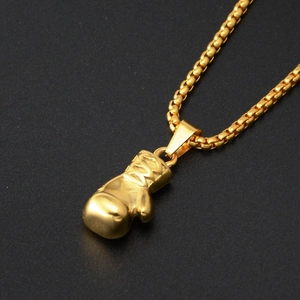 Polished gold boxing glove pendant on a ball chain necklace with hip-hop style