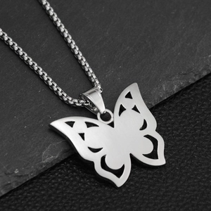 Macro detail of silver butterfly pendant with brushed metal finish and sturdy box chain