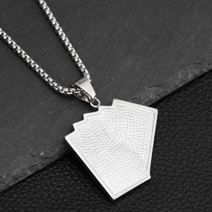 Macro view of iced out royal flush poker pendant with shiny crystals and box chain